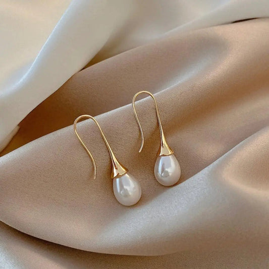 Boucles d'oreilles pendantes en perles dorées