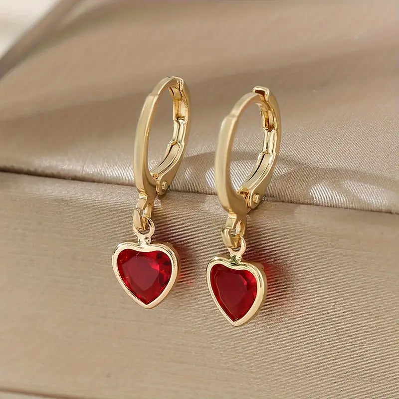 Boucles d'oreilles pendantes cœur rubis en or
